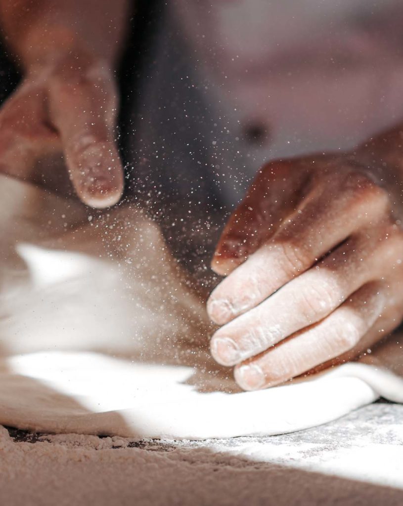 pizza-dough-hands-in-flour-99522H8.jpg